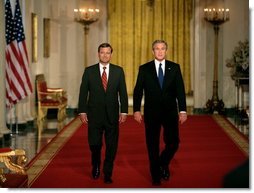 President George W. Bush walks with his Supreme Court Justice Nominee John Roberts before delivering the announcement on the State Floor of the White House, Tuesday evening, July 19, 2005.  White House photo by Eric Draper