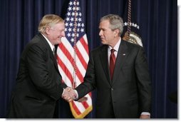 President George W. Bush shakes hands with William F. Buckley, Jr., Thursday, Oct. 6, 2005 at the Eisenhower Executive Office Building in Washington, to honor the 50th anniversary of National Review magazine, which was founded by Buckley, and to recognize Buckley's upcoming 80th birthday.  White House photo by Paul Morse