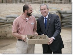 President George W. Bush shares a moment with Michael Lavin, senior conservator at the historic Jamestowne site Sunday, May 13, 2007, during a visit by the President and Mrs. Laura Bush in celebration of the settlement's 400th anniversary. The President urged all to come and see "the fantastic history that's on display." He added, "I think you'll be amazed at how our country got started."  White House photo by Shealah Craighead